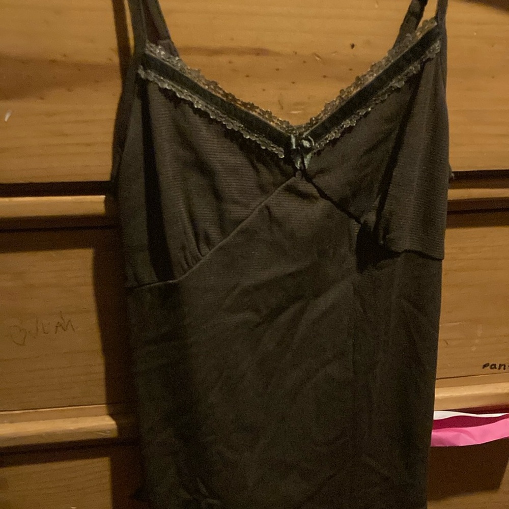 A medium brown tank top and the designer name is hazel